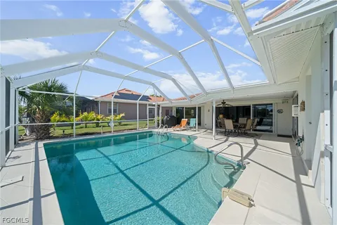 a view of a yard with table and chairs