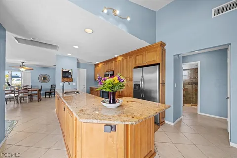 a large kitchen with stainless steel appliances lots of counter top space