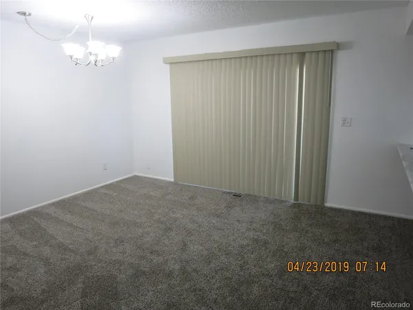 an empty room with a wooden door