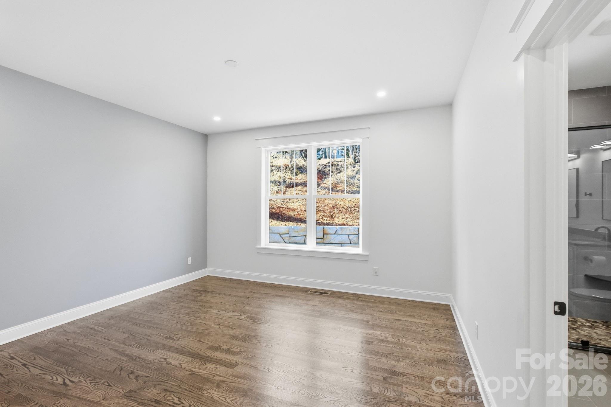 22 Deep Woods Road Weaverville, NC 28787 - Photo 14 of 37 a view of an empty room with a window