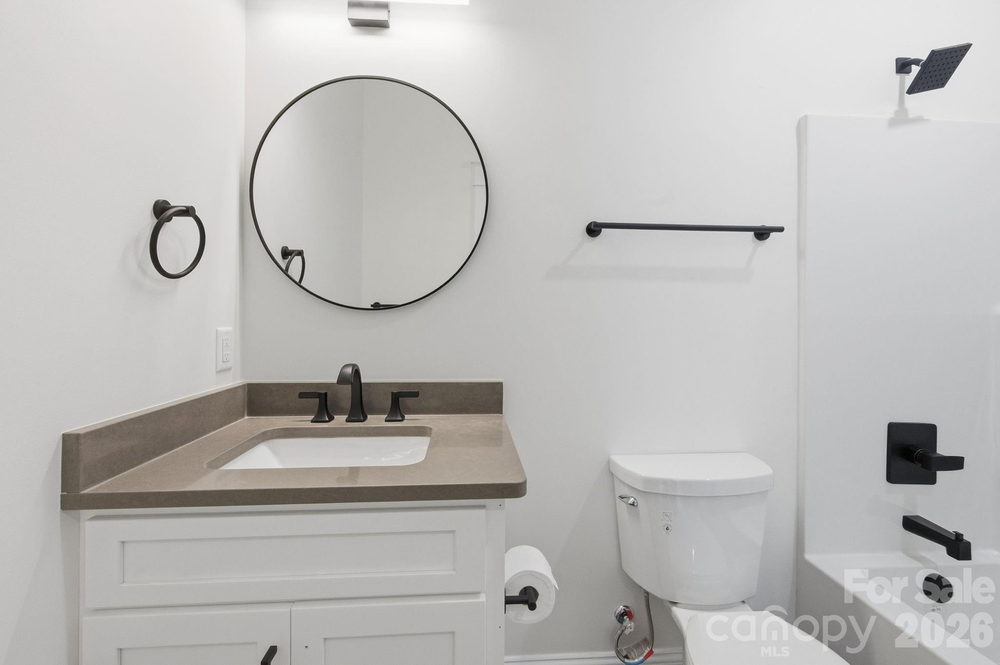 22 Deep Woods Road Weaverville, NC 28787 - Photo 21 of 37 a bathroom with a sink a toilet and a mirror