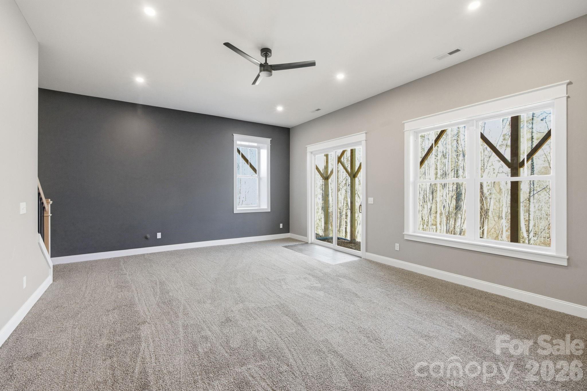 22 Deep Woods Road Weaverville, NC 28787 - Photo 24 of 37 an empty room with windows and ceiling fan