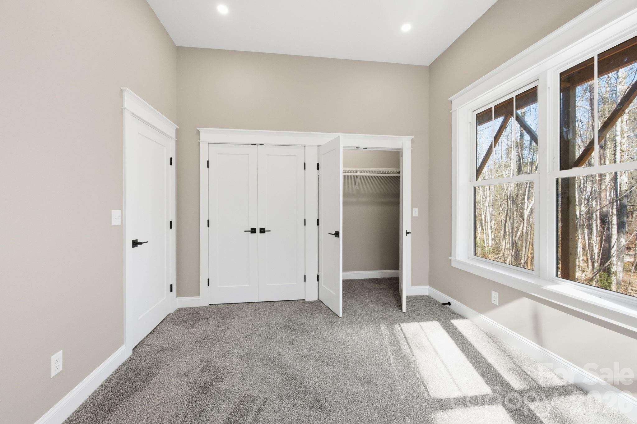22 Deep Woods Road Weaverville, NC 28787 - Photo 27 of 37 a view of an empty room with a large window