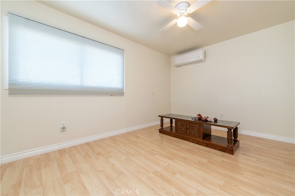 641 North Milford Road Orange, CA 92867 - Photo 12 of 25 an empty room with wooden floor and fan