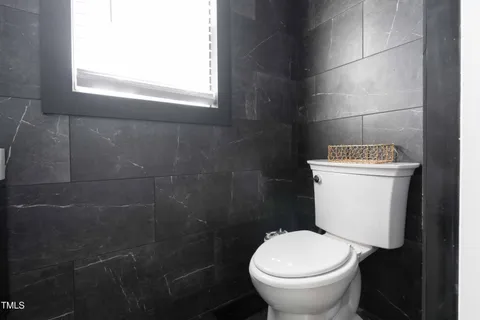 a bathroom with double sink and a mirror