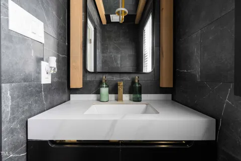 a kitchen with stainless steel appliances granite countertop a stove and a microwave