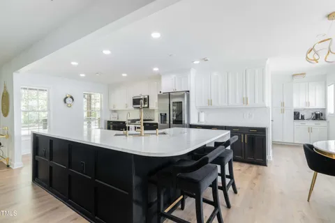 a living room with a couch and ceiling fan