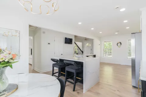 a view of a dining room with furniture window and outside view