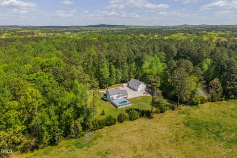 a view of a backyard with a trees