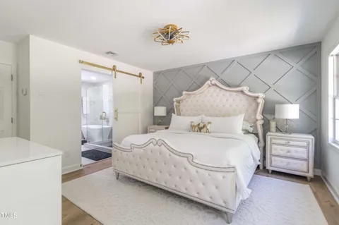 a bathroom with a shower a toilet and sink