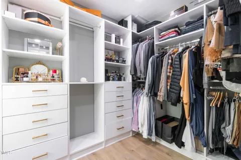a bathroom with a toilet sink vanity and mirror