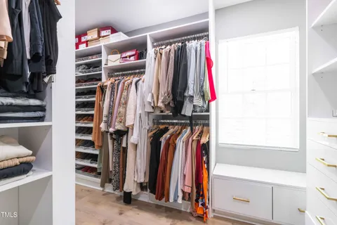 a bedroom with furniture and a window
