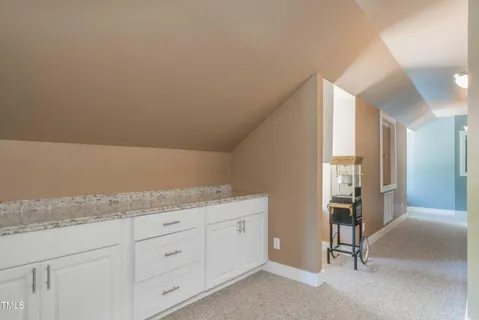 a bedroom with a bed and a cabinets