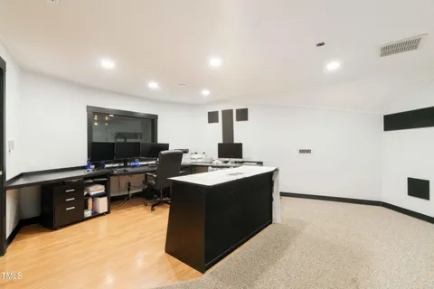 a view of a livingroom with furniture and a ceiling fan