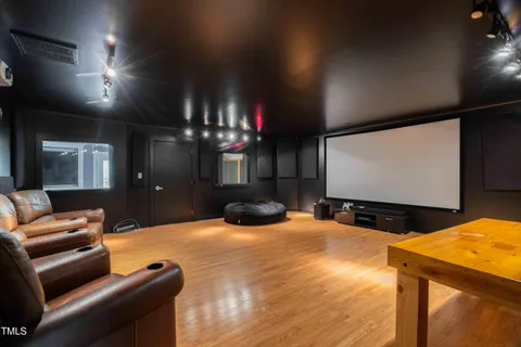 a living room with lots of furniture and a gym equipment