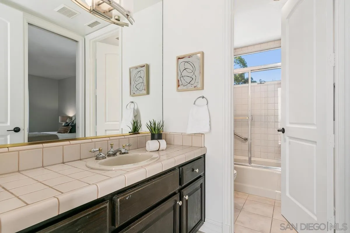 255 Cole Ranch Road Encinitas, CA 92024 - Photo 23 of 45 a bathroom with a sink double vanity and a mirror
