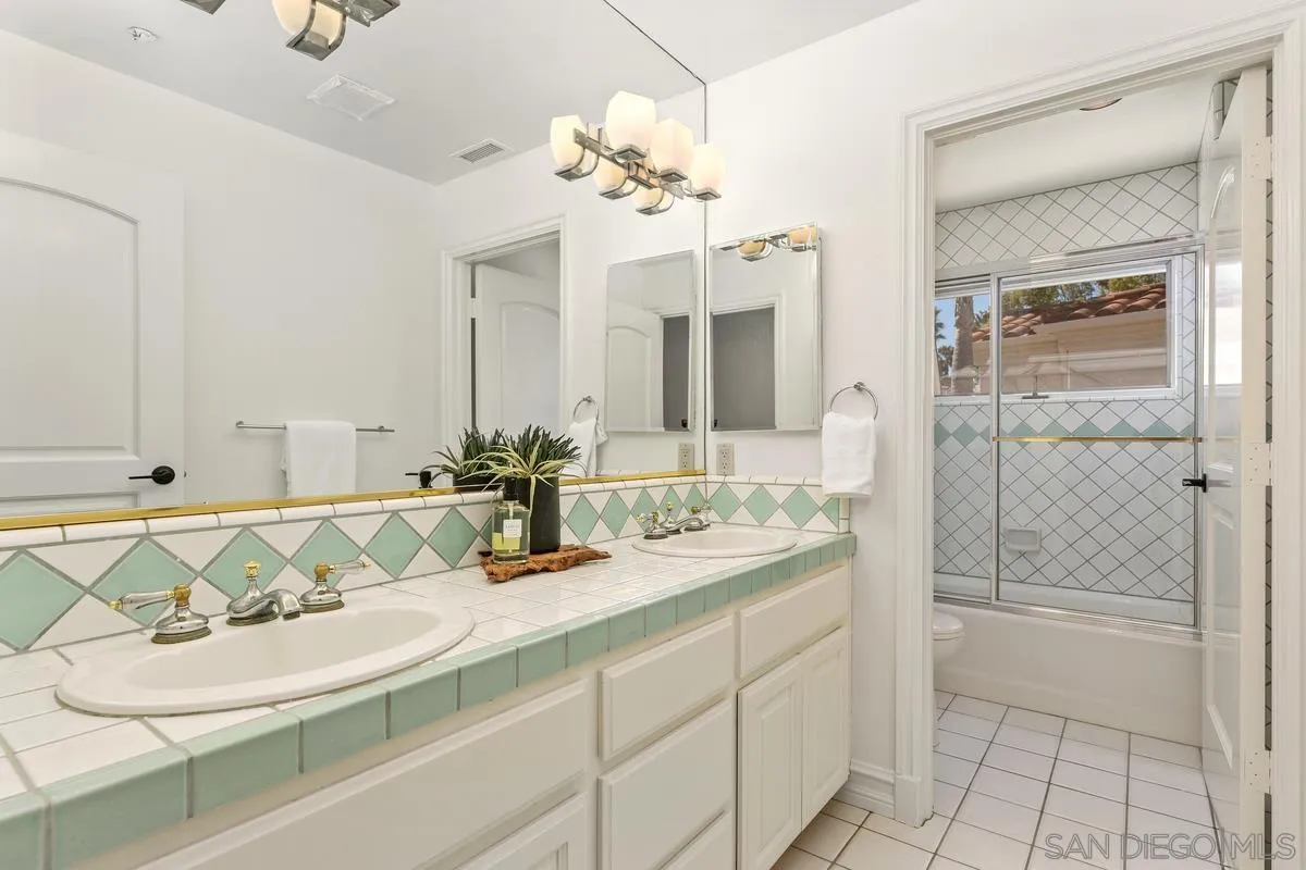 255 Cole Ranch Road Encinitas, CA 92024 - Photo 34 of 45 a bathroom with a sink and a mirror