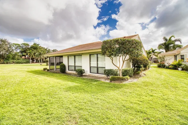 a view of a lake with a yard