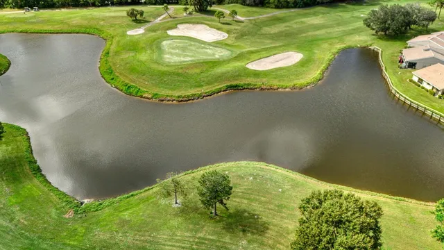 a view of a swimming pool in a backyard