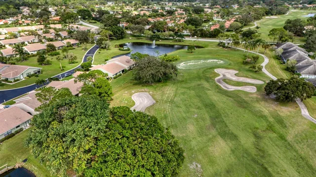 an aerial view of a house with a swimming pool