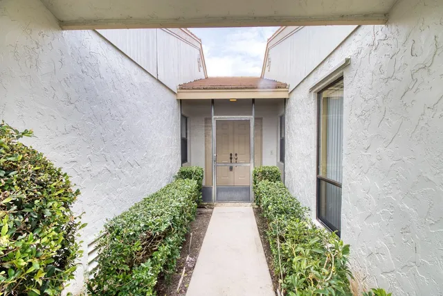 a view of a pathway besides a house