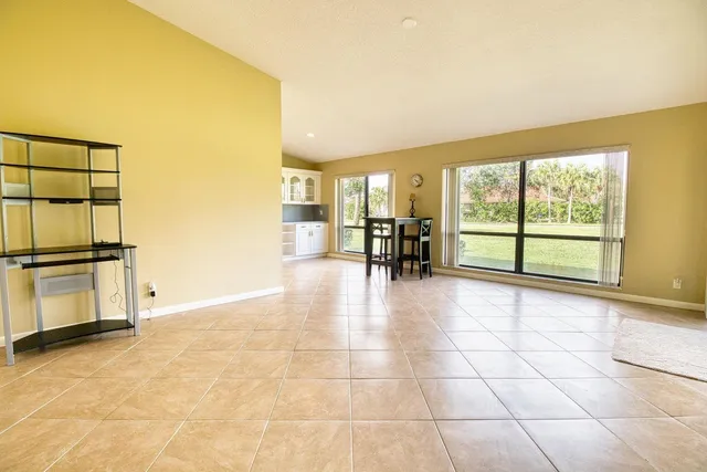 a view of a kitchen with furniture and a window