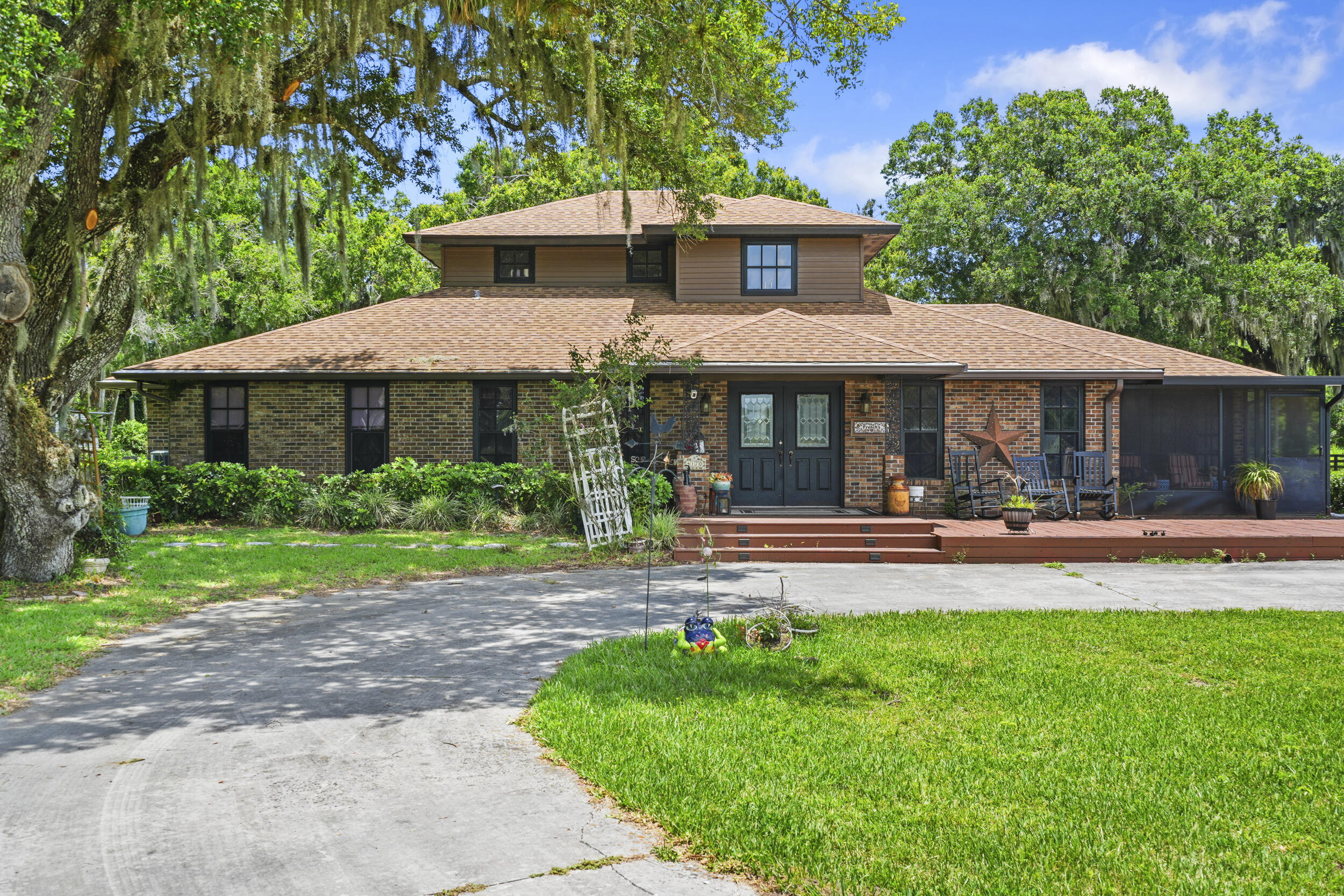 4170 McCarty Road Fort Pierce, FL 34945 - Photo 7 of 57 a view of a house with a yard and sitting area