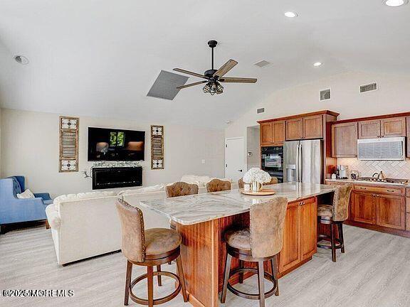 58 Tunes Brook Drive Brick, NJ 08723 - Photo 1 of 2 a kitchen and a dining room with furniture