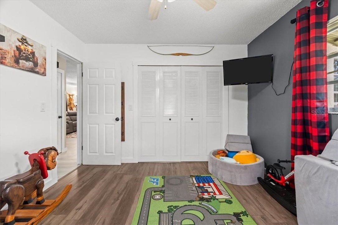 424 Wisconsin Avenue St. Cloud, FL 34769 - Photo 20 of 36 a bed room with a bed and a couch