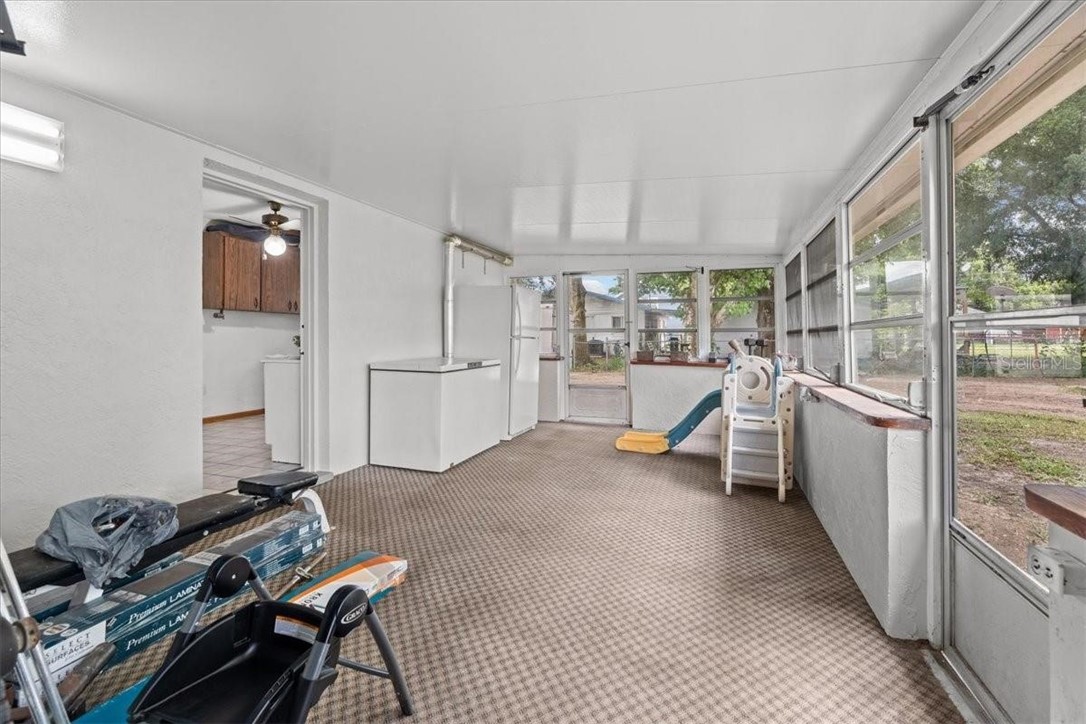 424 Wisconsin Avenue St. Cloud, FL 34769 - Photo 26 of 36 a view of a room with gym equipment and windows