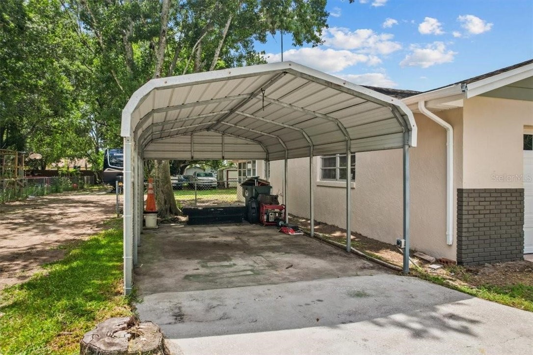 424 Wisconsin Avenue St. Cloud, FL 34769 - Photo 29 of 36 a view of a car park in front of house