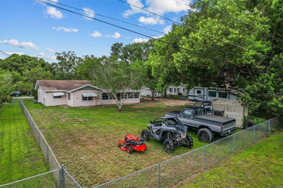 424 Wisconsin Avenue St. Cloud, FL 34769 - Photo 31 of 36 a front view of a house with garden