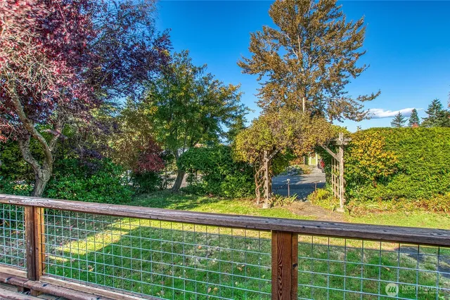 a view of balcony with wooden floor