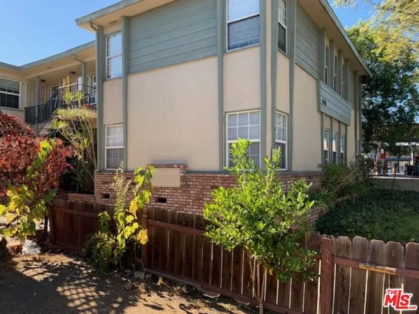 a plant that is in front of a house
