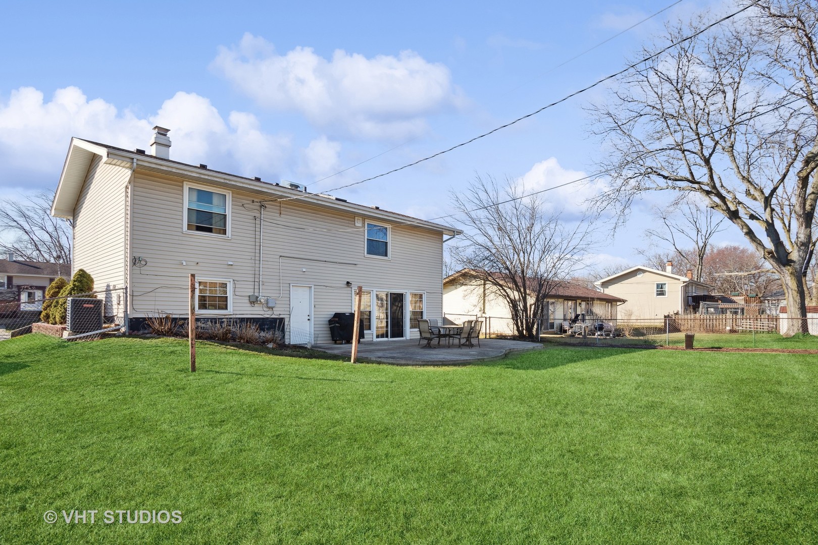 1470 Nottingham Lane Hoffman Estates, IL 60169 - Photo 16 of 16 a view of a house with a yard and sitting area