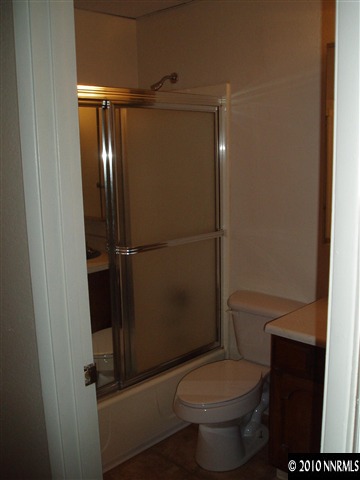 18 Vine Street Reno, NV 89503 - Photo 5 of 6 a white toilet sitting next to a shower