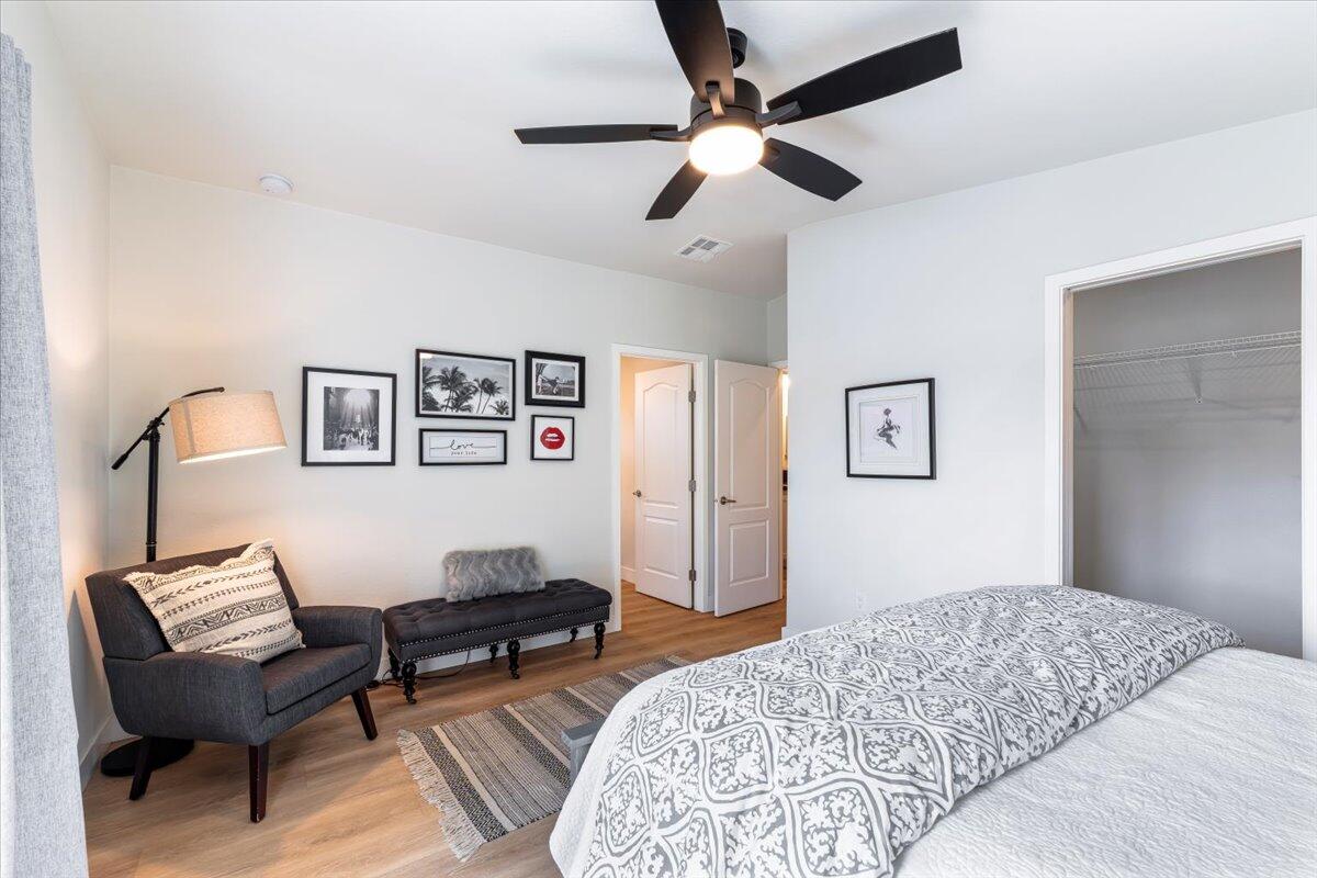 333 Old Mill Road, Unit SPC 157 Santa Barbara, CA 93110 - Photo 11 of 23 a bedroom with a bed and wooden floor