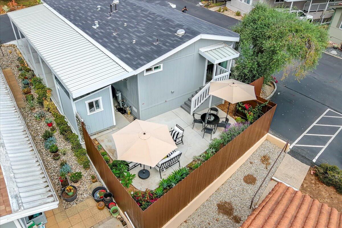 333 Old Mill Road, Unit SPC 157 Santa Barbara, CA 93110 - Photo 16 of 23 an aerial view of a house with a yard and potted plants