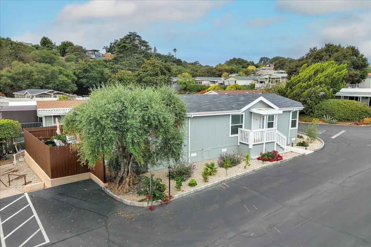 333 Old Mill Road, Unit SPC 157 Santa Barbara, CA 93110 - Photo 19 of 23 a front view of a house with a yard