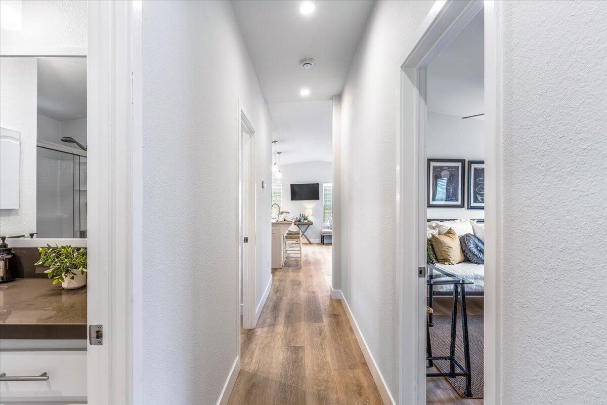 333 Old Mill Road, Unit SPC 157 Santa Barbara, CA 93110 - Photo 9 of 23 a view of a hallway with wooden floor and a living room