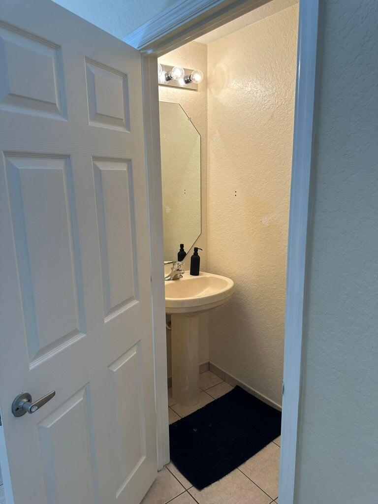 1943 Hibiscus Lane Riviera Beach, FL 33404 - Photo 13 of 14 half bath