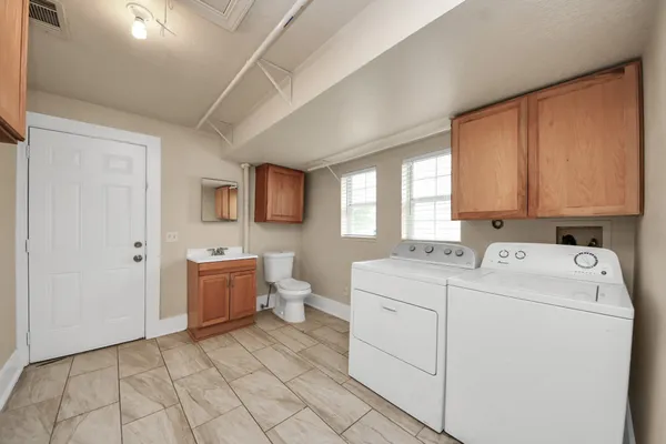 a utility room with dryer and washer