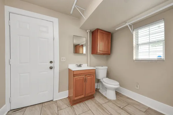 a bathroom with a toilet and a sink