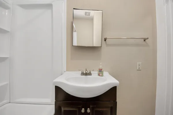 a bathroom with a bathtub and shower