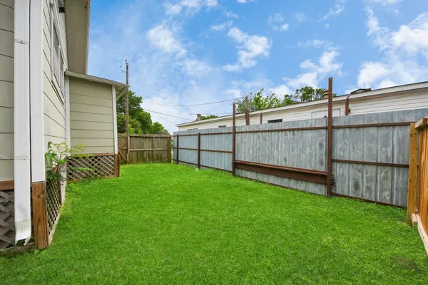 a backyard of a house with lots of green space
