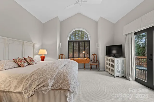 a bed room with a bed and a chair