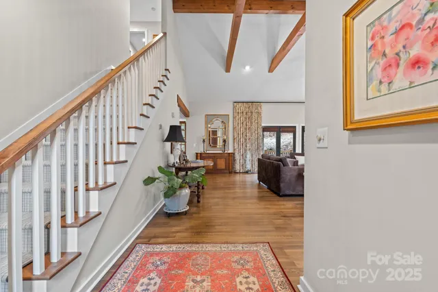a view of a backyard with plants and outdoor seating