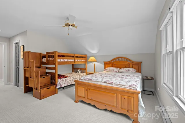 a view of a house with large windows and wooden floor