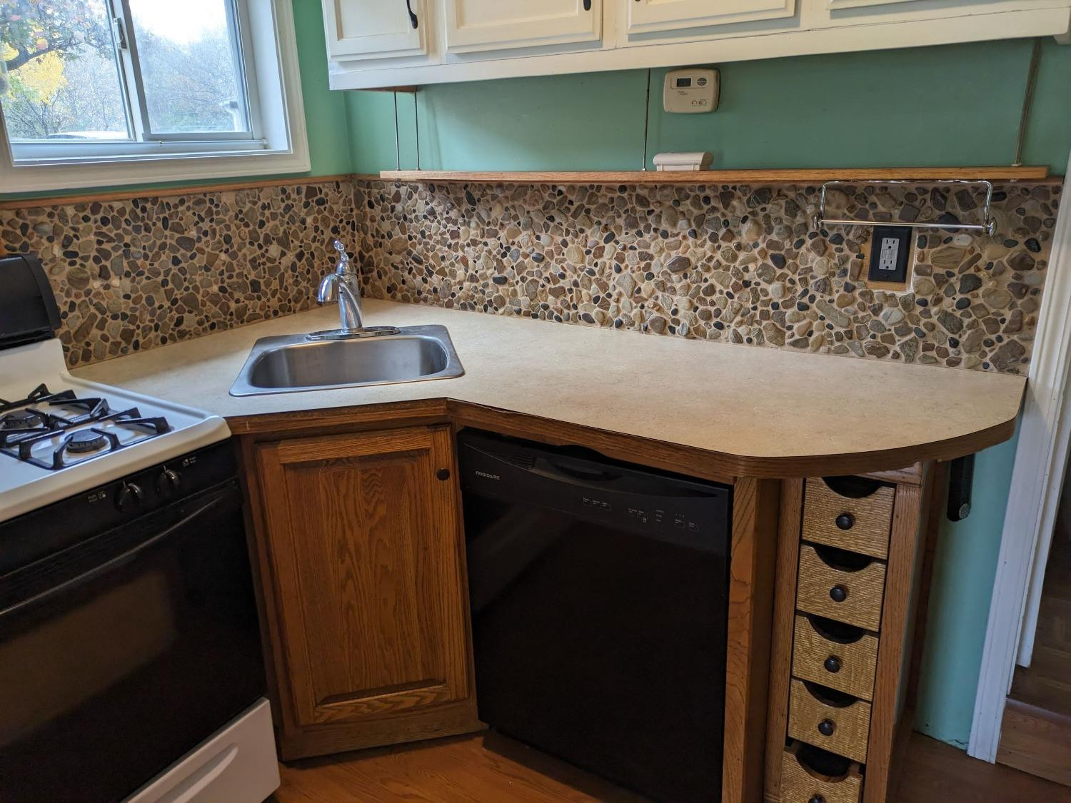 23809 Shelby Road Lowell, IN 46356 - Photo 16 of 48 a kitchen with a sink and cabinets