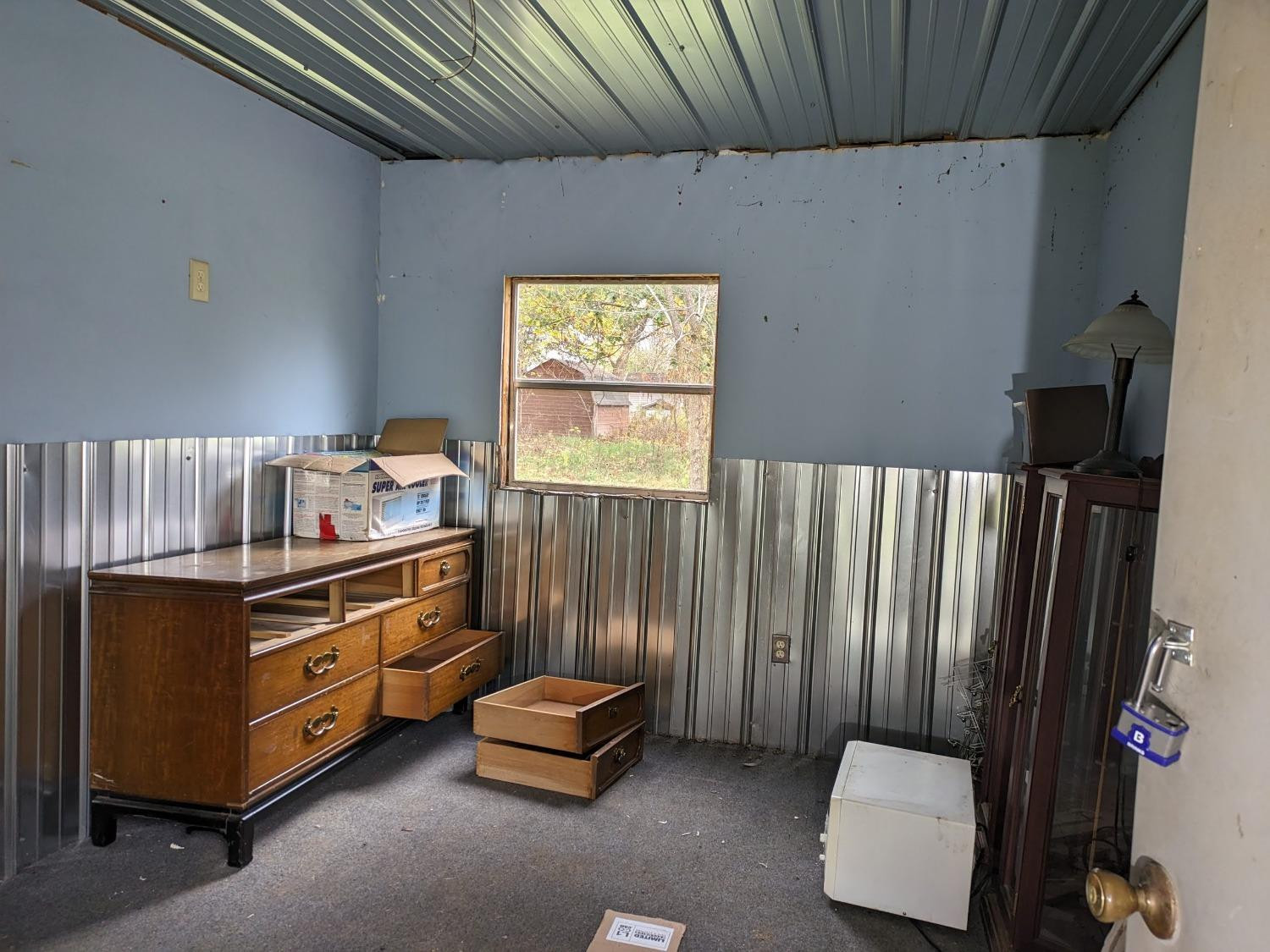 23809 Shelby Road Lowell, IN 46356 - Photo 34 of 48 a room with a bed and a dresser